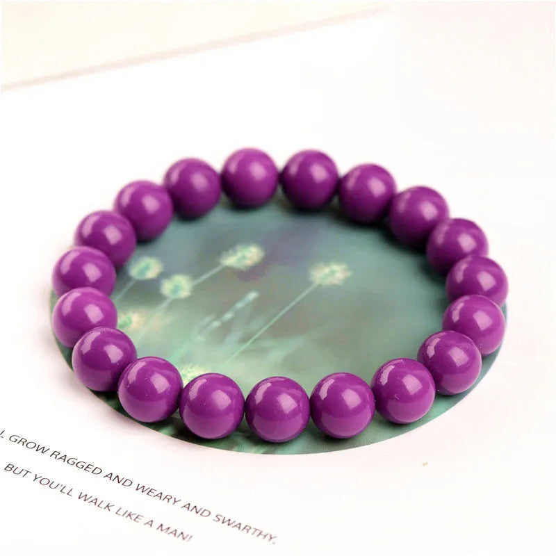 Purple mica crystal bracelet on wrist showing polished finish and single circle design.