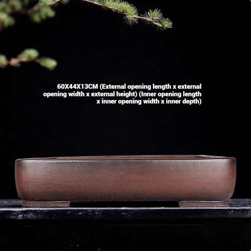 Large rectangular antique purple clay flower pot for indoor plants on a tabletop.