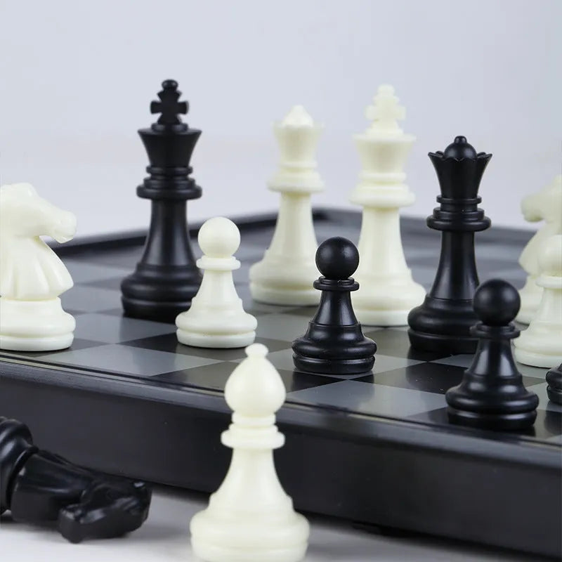 Portable folding ABS chessboard in 32cm size on a table
