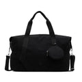 Lightweight black and green Oxford cloth gym bag with polyester lining.