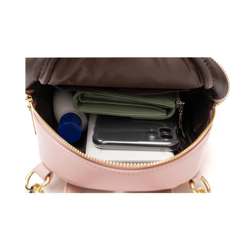 Soft PU mini backpack in street fashion design with contrast colour detailing and interior compartments