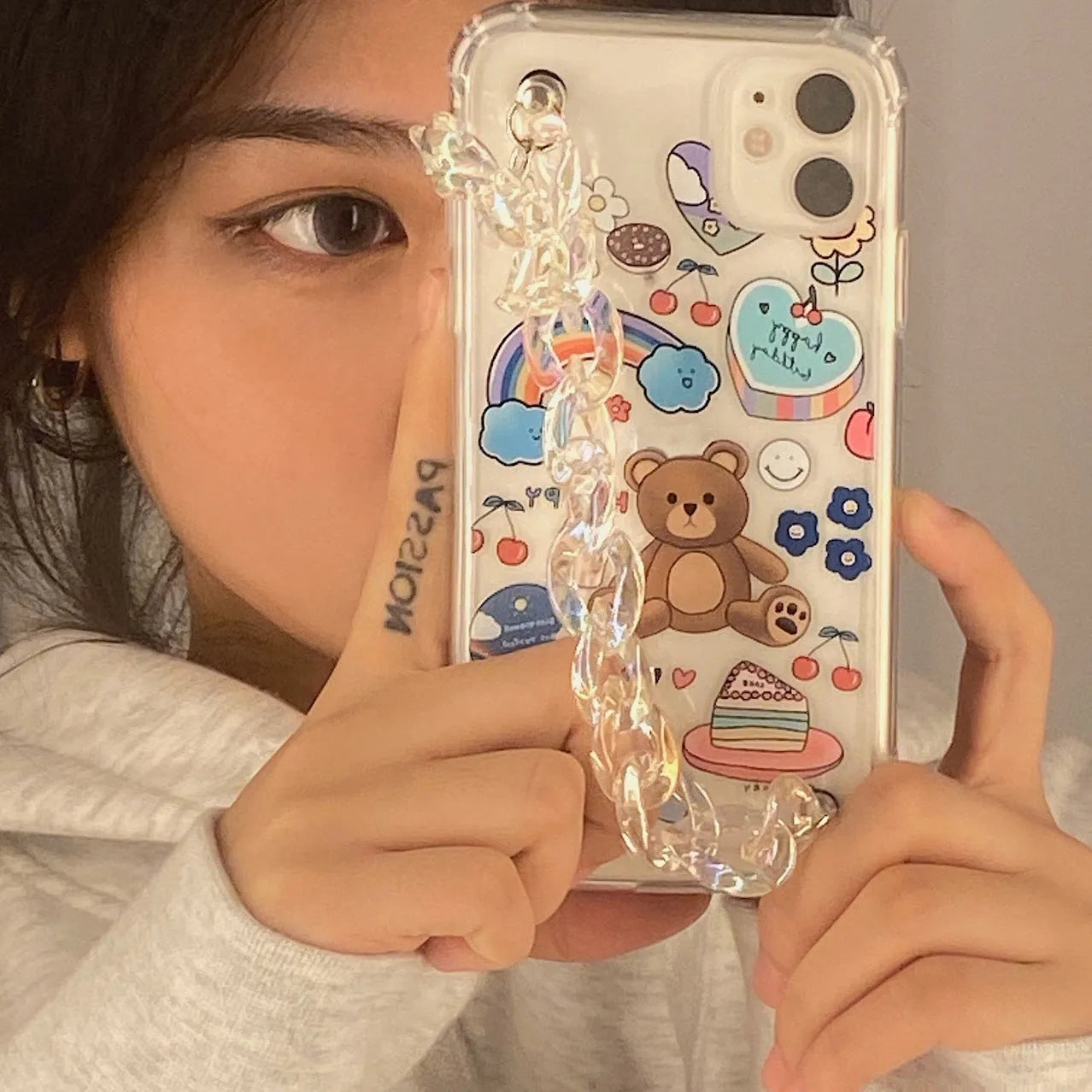 Bear chain charm on a TPU protective case for iPhone, featuring a Japanese Korean cartoon style design.