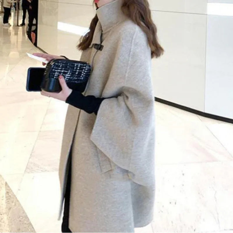 Women's oatmeal coloured acrylic coat with flight sleeves showing 100cm length