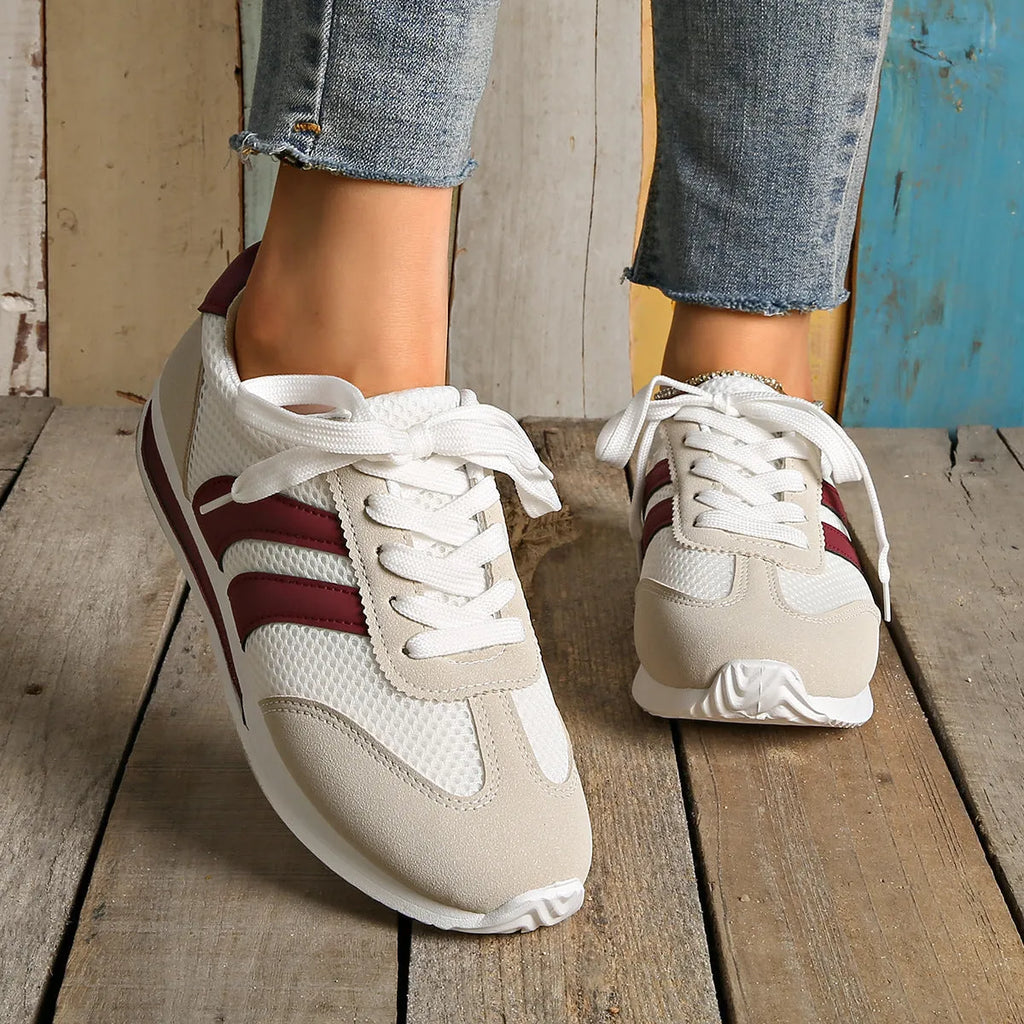Wine red Cortez Retro low-top sneakers with a cross-strap and breathable mesh panels.