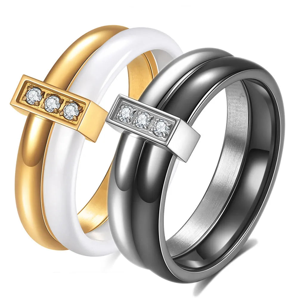 Geometric ceramic women's ring with glossy stitching and zirconium accents in steel black.