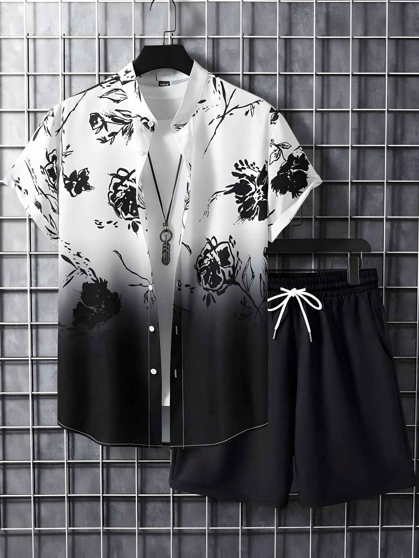 Black and white striped Hawaiian men's pullover shirt and shorts set on a model, loose fit, short sleeves.