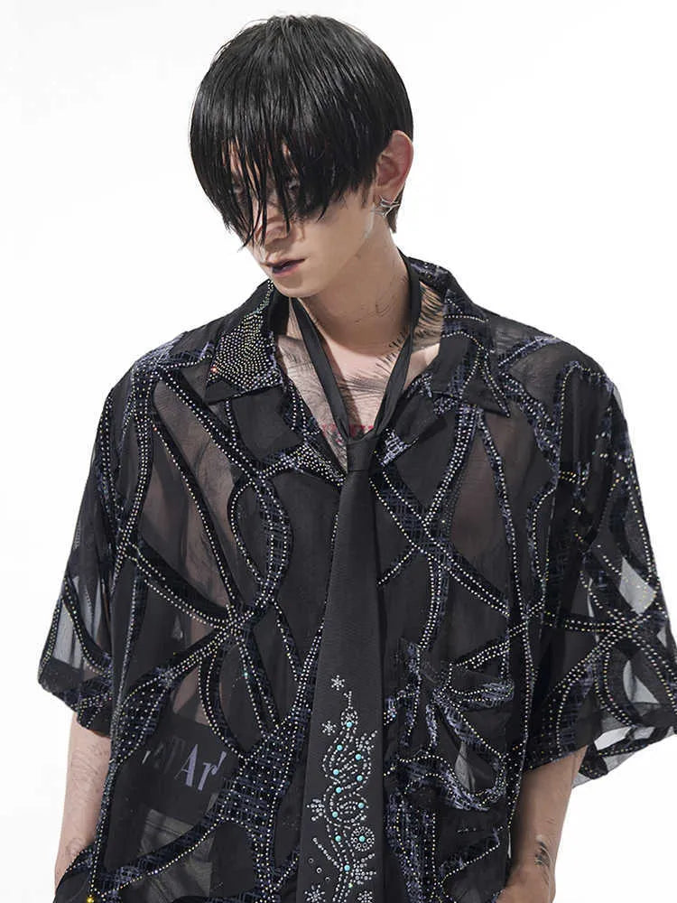 Man's loose fit short-sleeved shirt with translucent snake pattern in black or grey.