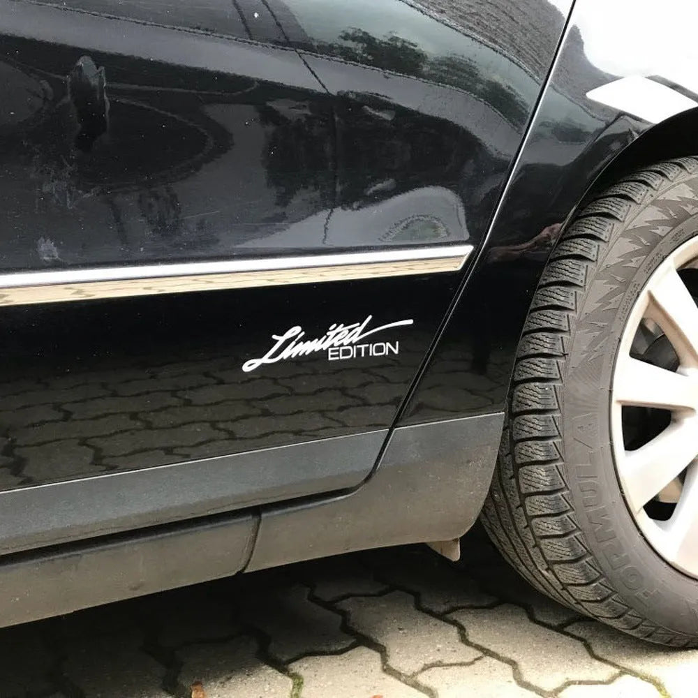 British reflective plastic bumper sticker in black, white, or colourful, showing 16cm by 3.8cm size.