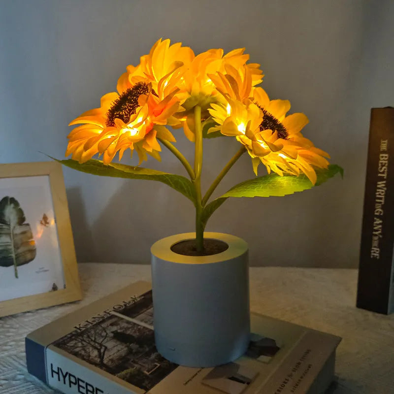 Rechargeable sunflower LED night light with artificial flower design on table