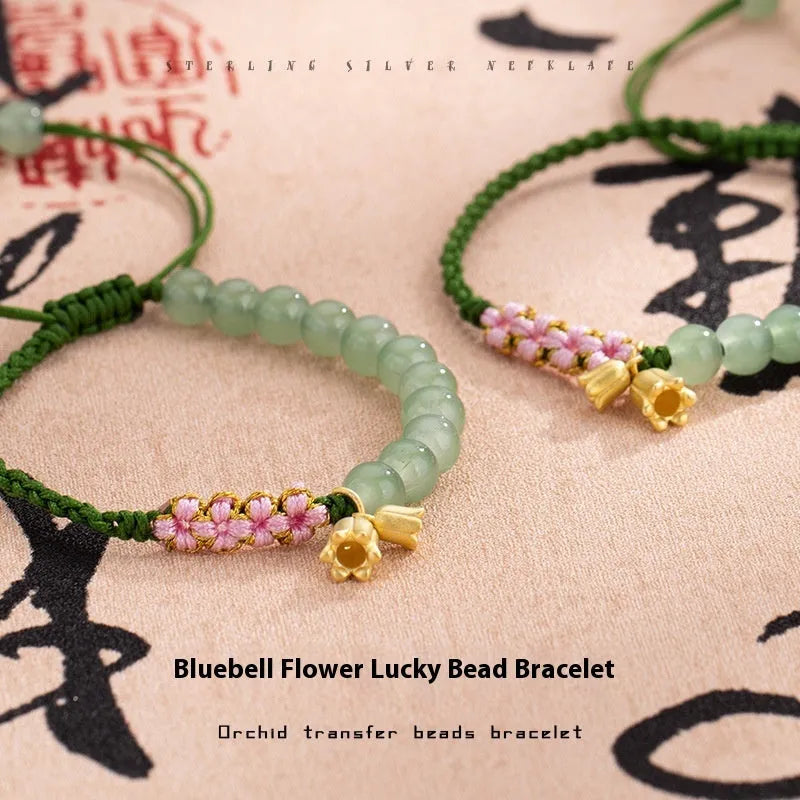 Hand woven red rope bracelet with floral design elements in Lily Carrying Strap colour