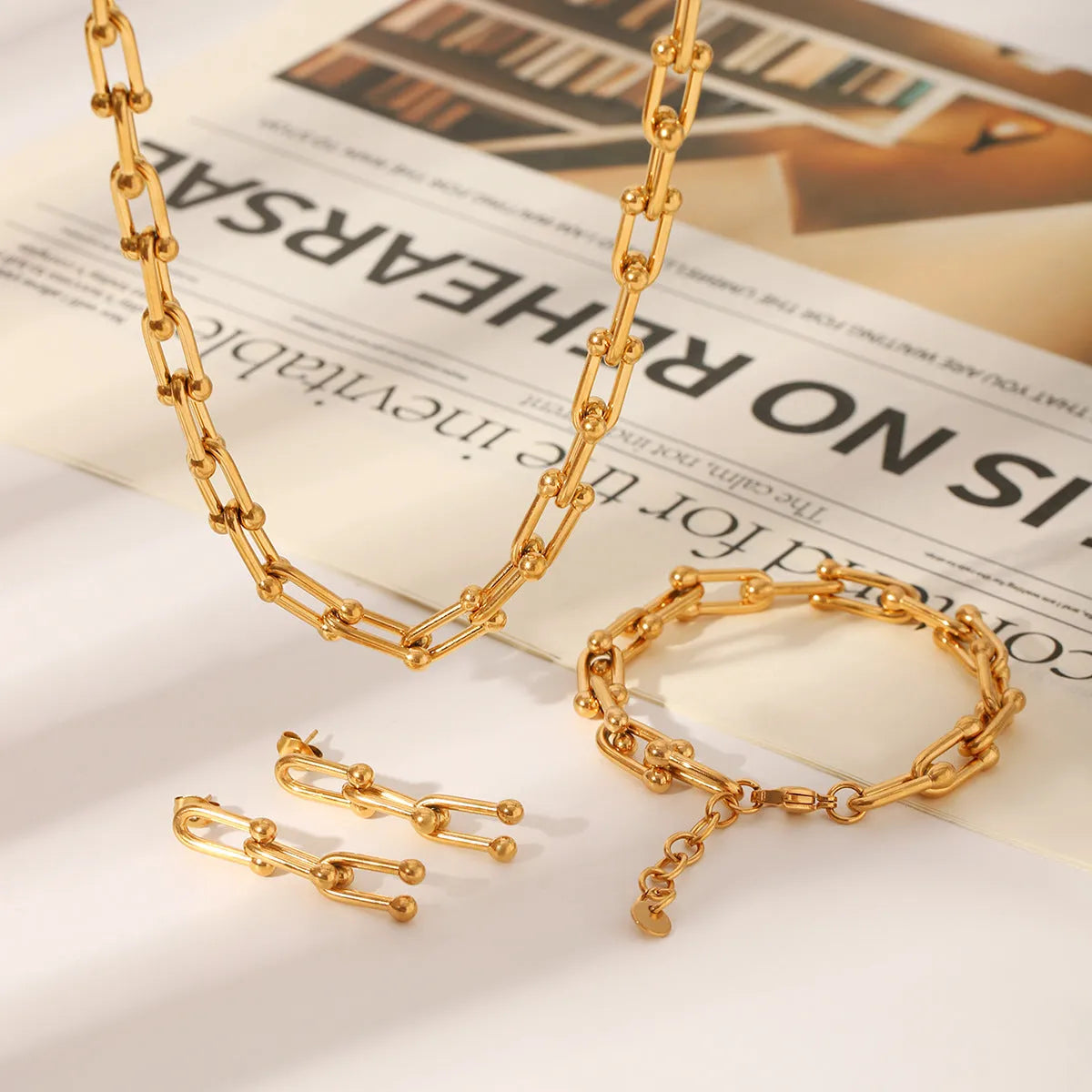 Stainless steel horseshoe chain jewellery set with titanium pendant in multiple colour options