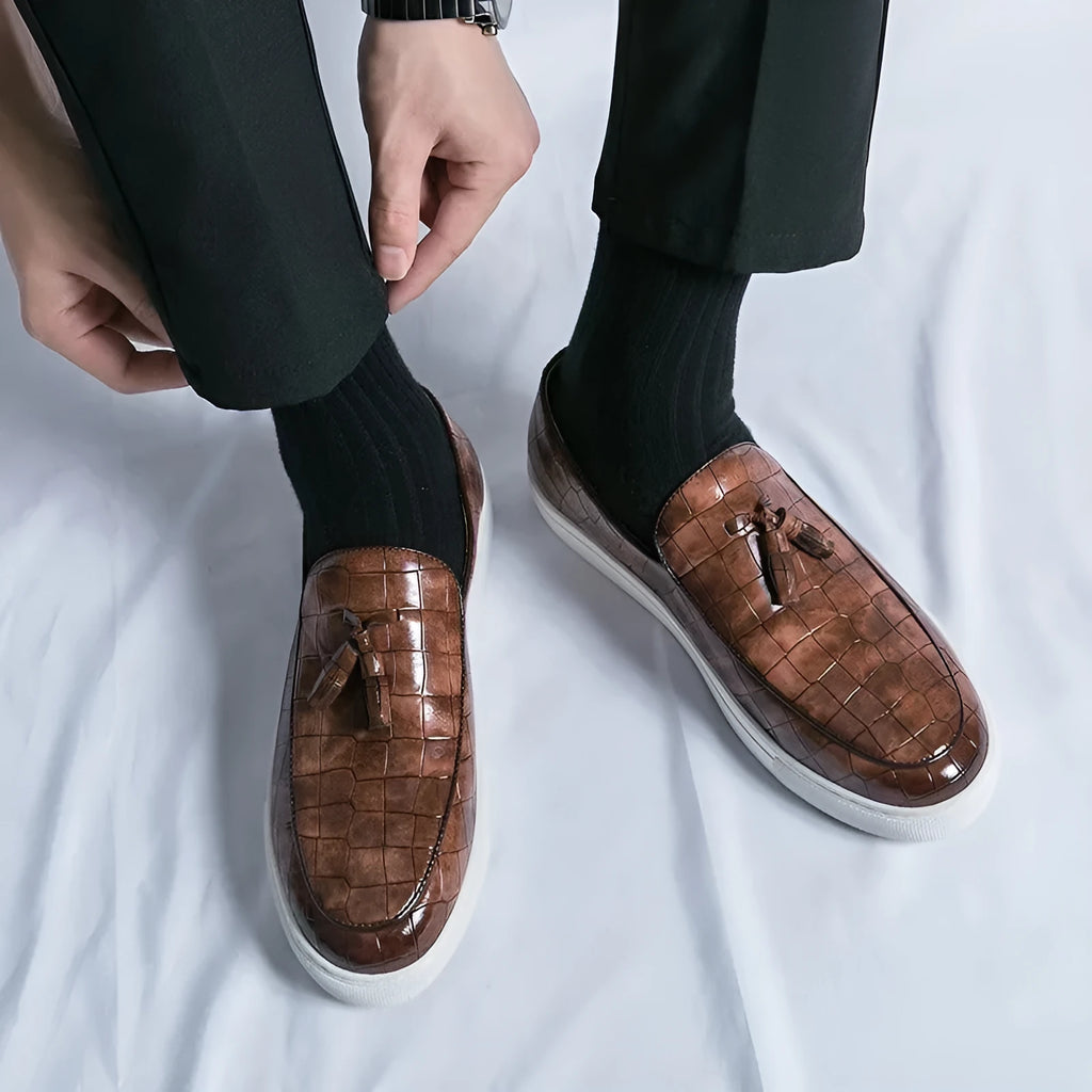 Men's black synthetic leather sneakers with tassle detail and oversleeve design.