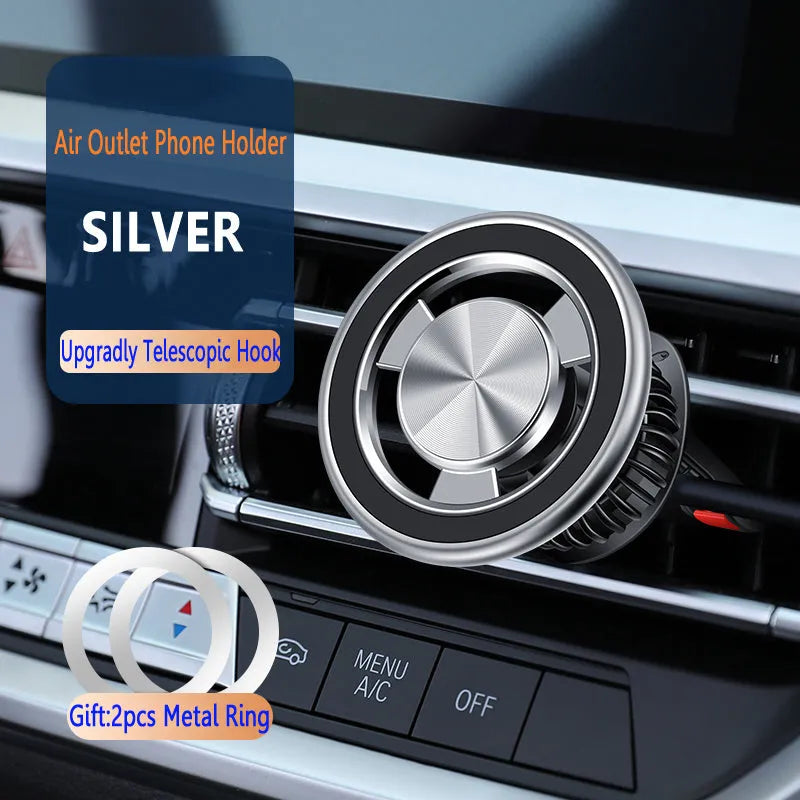 Silver and black magnetic car phone holder attached to a car air vent.