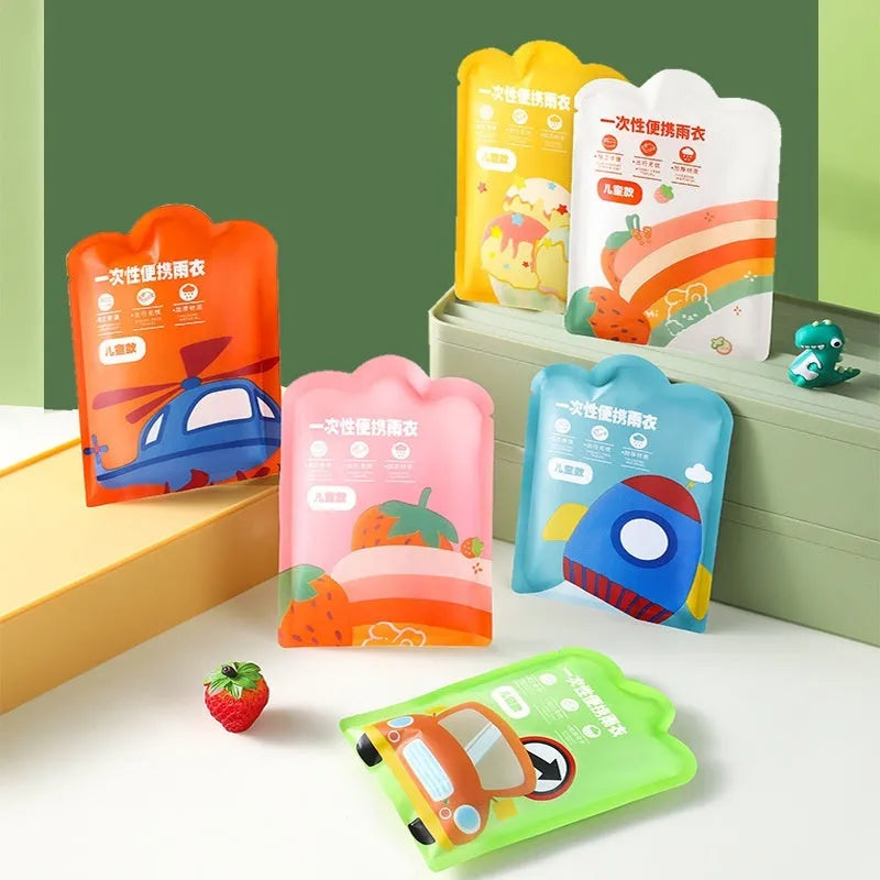 Disposable children's long plastic rain poncho folded to 13cm by 9cm size in various colours.