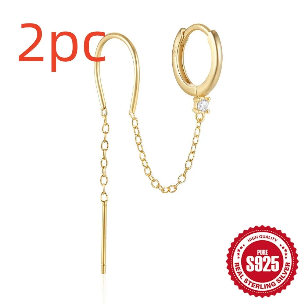 S925 sterling silver stud earring with a diamond-shaped flower, dangling tassel, and chain detail in a golden colour.