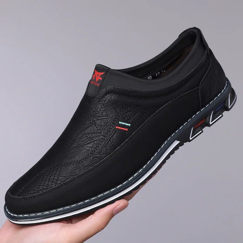 Men's leather slip-on casual shoes in black, gray, khaki and orange colours with low-top design