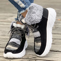 Beige women's lace-up suede snow boots with a fuzzy lining and thick rubber sole.