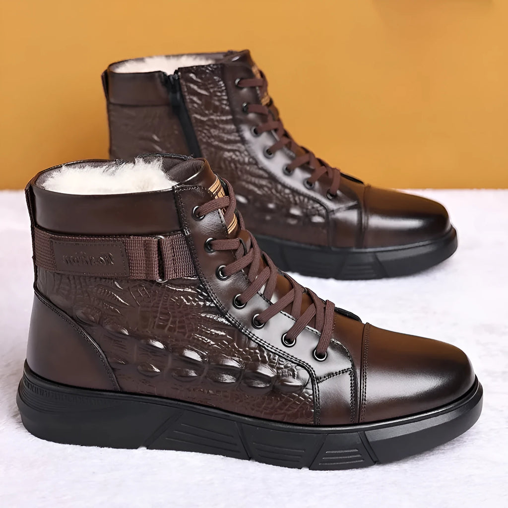 Black fur-integrated genuine leather winter boots with rubber soles and front laces on a white background.