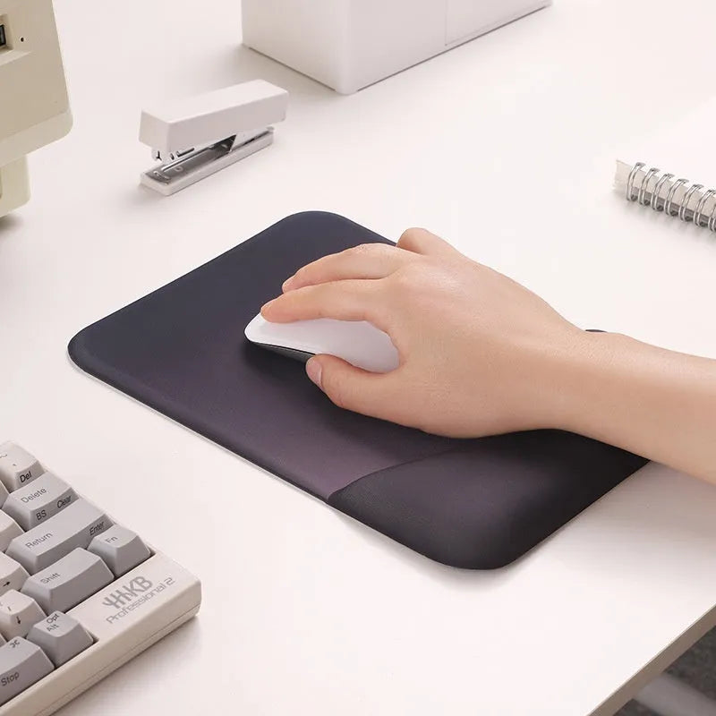 Square cloth wrist rest mouse pad with hand pillow in purple on a desk