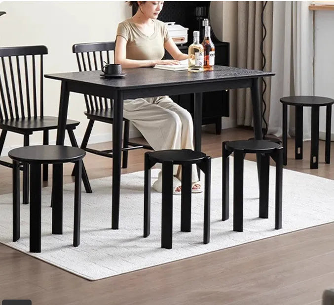 Stackable iron round dining stool in modern style, shown in one of four colour options.