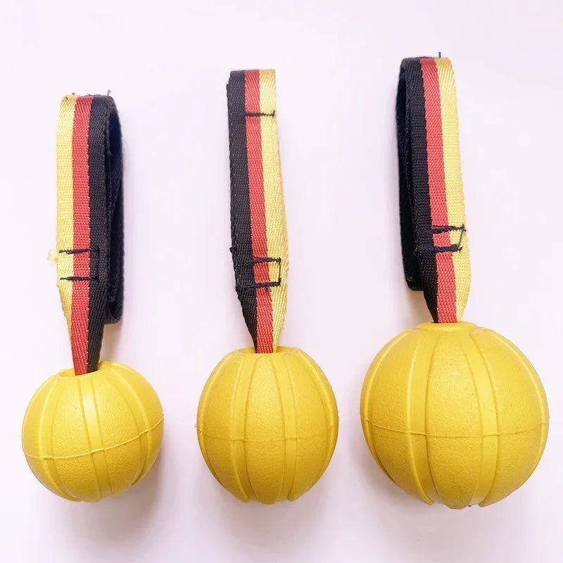 Yellow and camouflage EVA foam floating dog tetherballs in three different sizes for water fetch