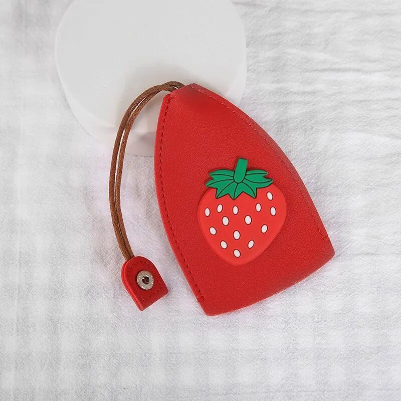 Cartoon pull-out key case in PU leather measuring 14 x 7.5 cm with colourful designs