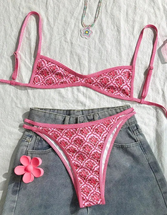 Pink printed two-piece bikini set with shoulder straps and exposed back cut-out for ladies