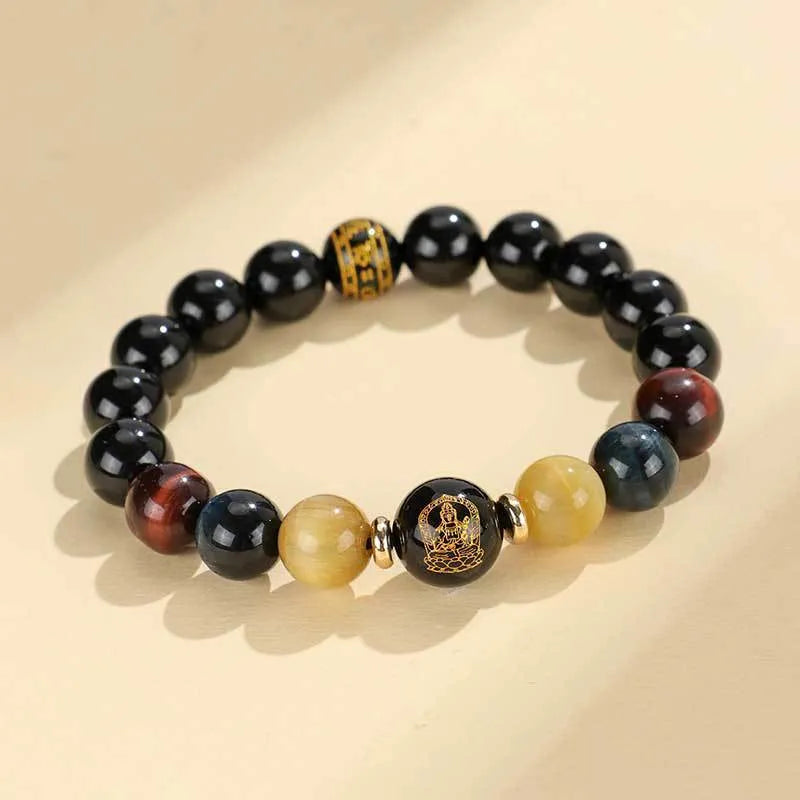 Handmade black agate bracelet with zodiac animal charms and gold tiger eye beads on wrist