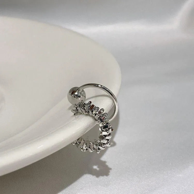 Geometric silver-tone alloy earrings with irregular frosty-style finish and ear clip fitting