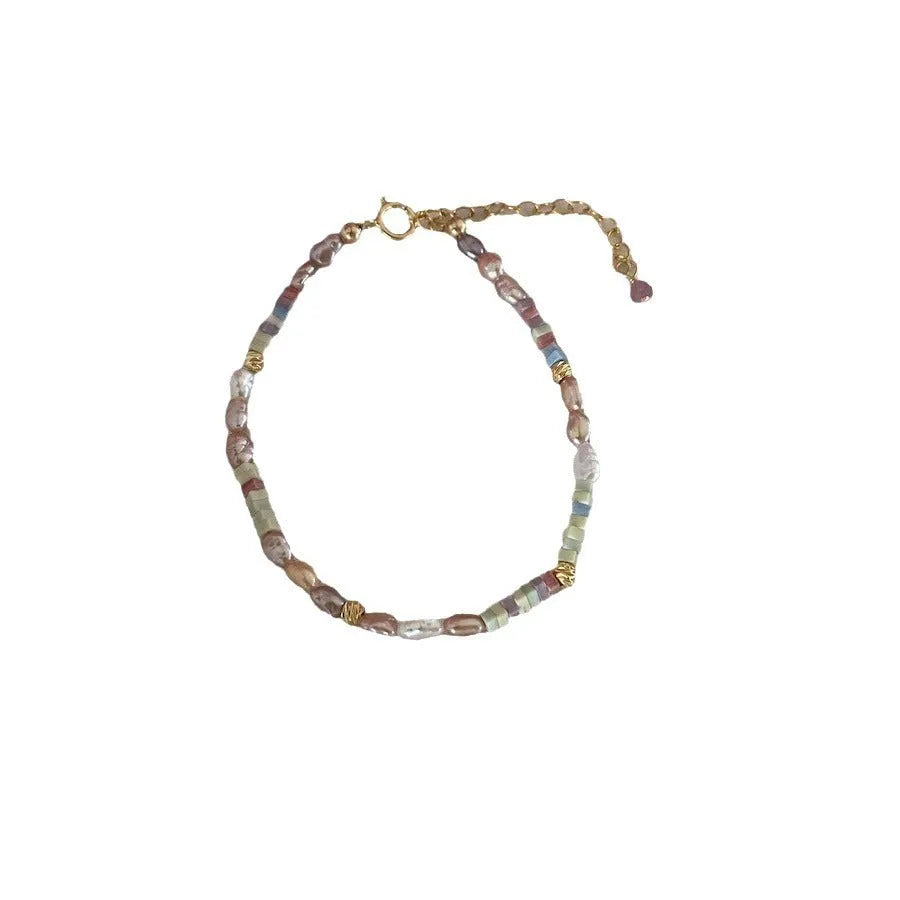 Natural irregular pearl bracelet and necklace set in 14k gilded purple silver tone.