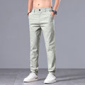 Men's straight-cut slim-fit casual trousers in light khaki cotton fabric for spring summer wear.