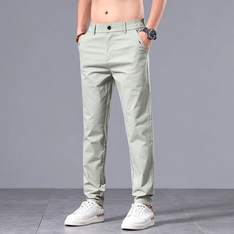 Men's straight-cut slim-fit casual trousers in light khaki cotton fabric for spring summer wear.
