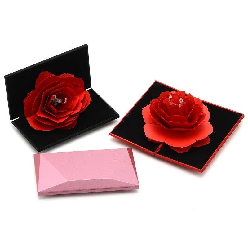 Red heart-shaped rotating plastic ring box for jewellery presentation