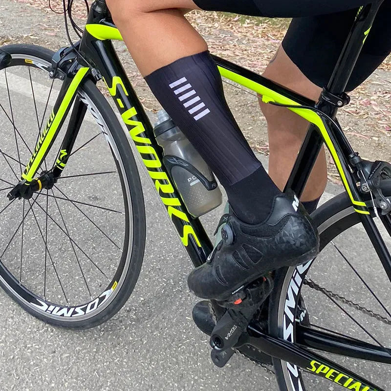 Pair of athletic socks for cycling and running in a chemical fibre blend, shown in one of six available colours.