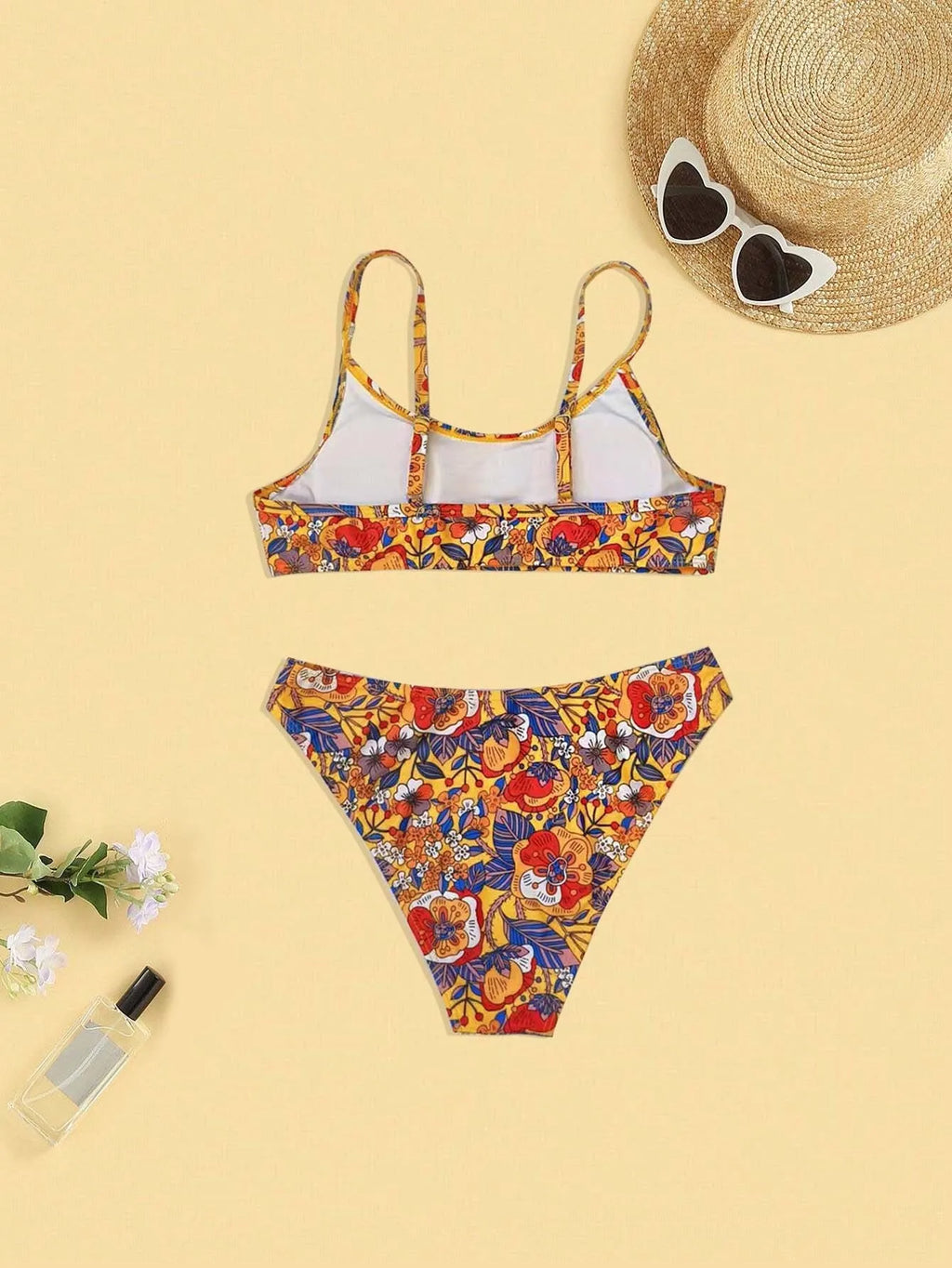 Plus size women's floral print bikini set with strapped design and brief style