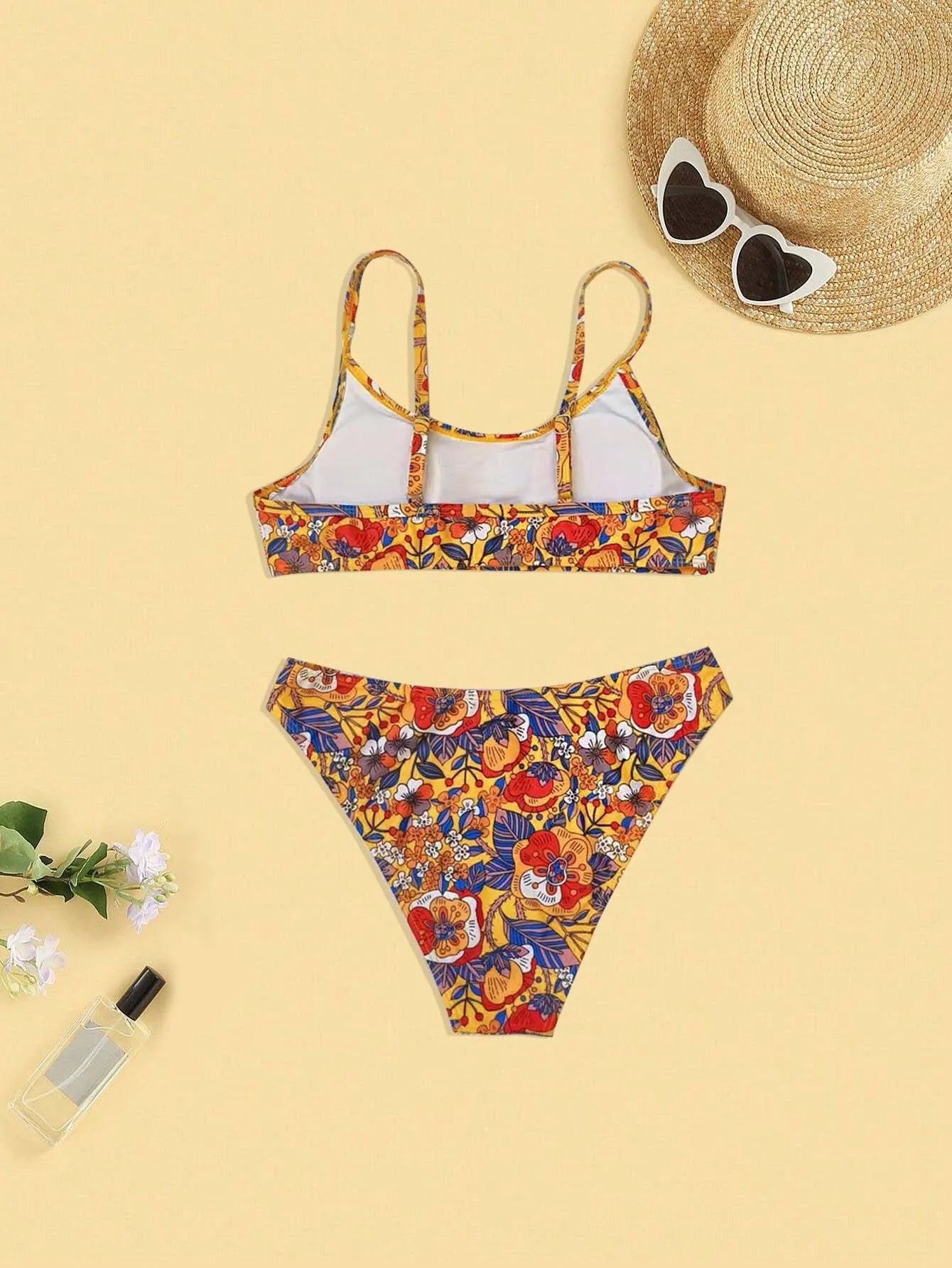 Plus size women's floral print bikini set with strapped design and brief style