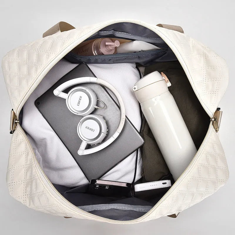 Large solid-colour Oxford cloth travel bag with a 36-55 litre capacity for buggies.