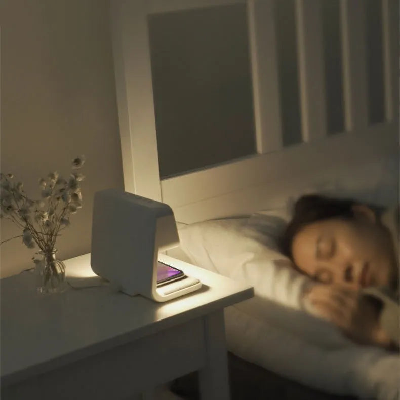 White 3-in-1 bedside lamp with wireless charging pad, LCD clock screen, and touch dimming controls