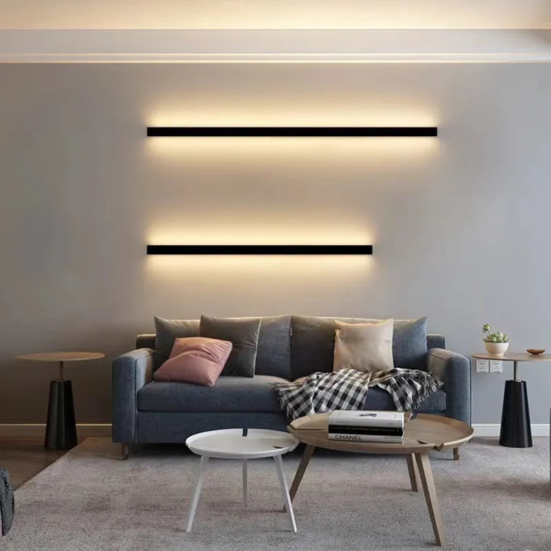 80cm long black aluminium LED wall lamp with touch control for three light colours on a white wall.