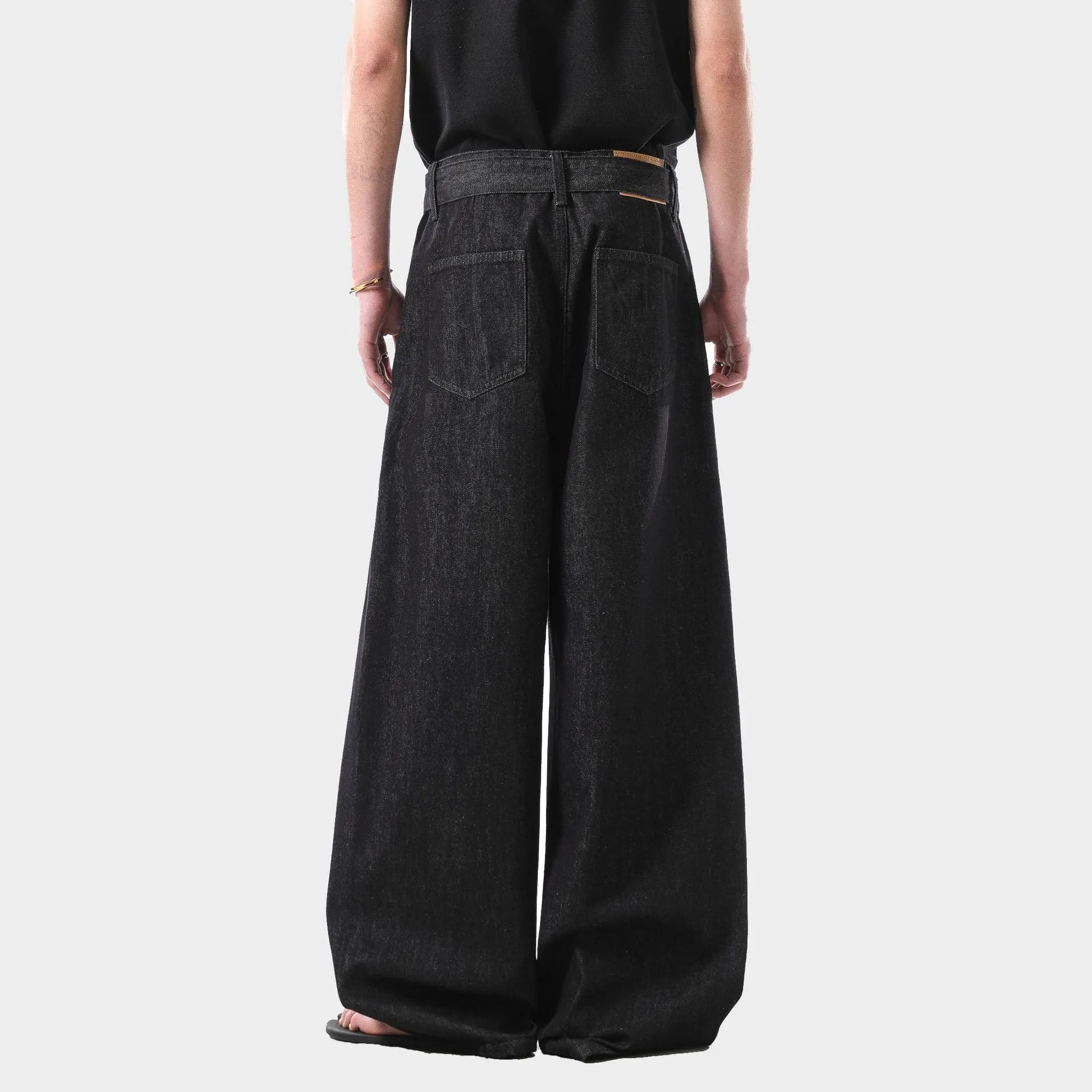 Women's retro black gold wash high waist straight leg cotton denim jeans on a hanger.