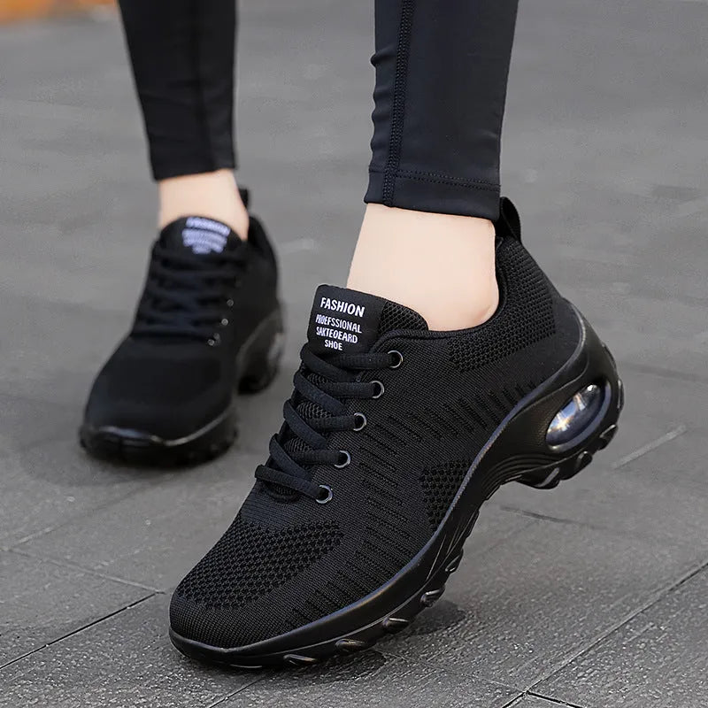 Red low-top women's mesh sneakers with front lace-up and round toe on a flat PU sole.