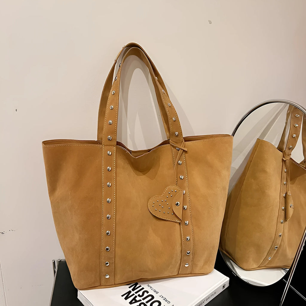 Women's black PU leather tote bag with double shoulder straps showing sandwich pocket detail