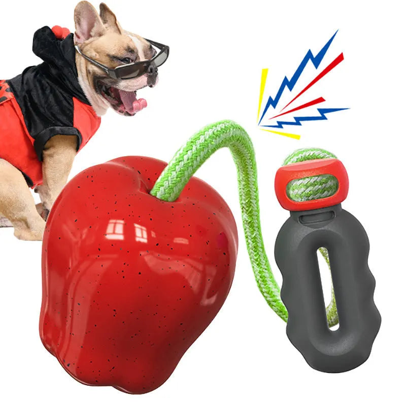 Green and red plastic dog dental toy ball with food-dropping feature and molar-shaped texture
