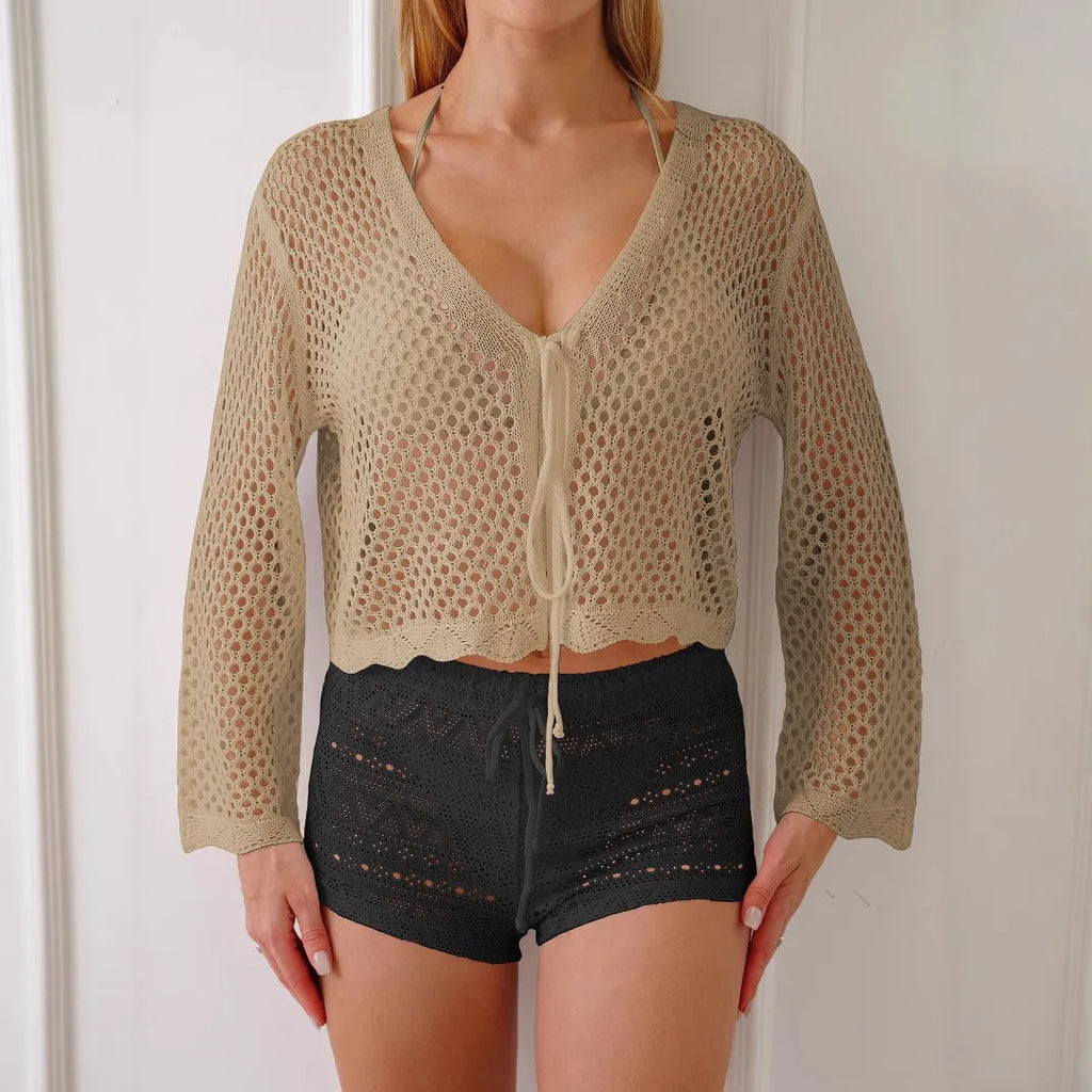 Short women's cardigan blouse with bell sleeves in hollow woven fabric, shown in black colour