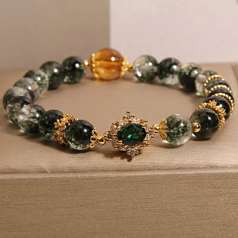 Gold rutilated quartz bracelet with green phantom quartz beads, gold ruby quartz accents, pearl and rhinestone details