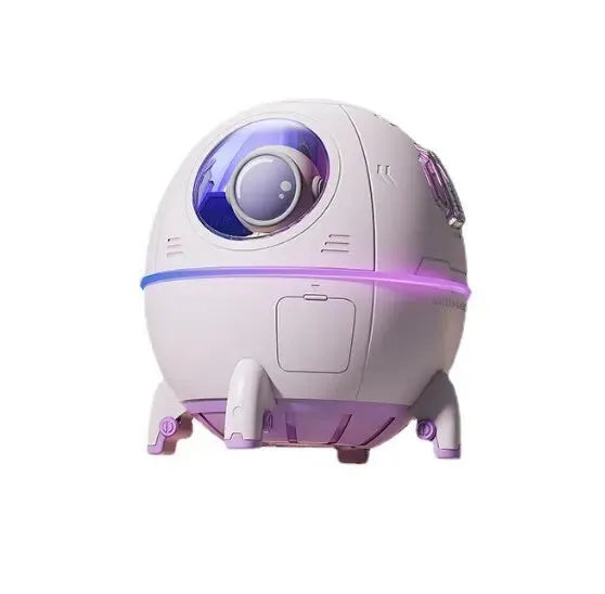 Astronaut-themed desktop USB humidifier with colourful LED light on a desk
