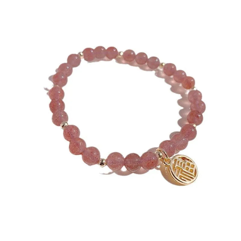 Strawberry quartz glass blessing card bracelet with adjustable clasp on wrist