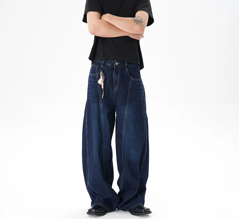 Dark blue women's wide-leg denim jeans with distressed detailing on the legs.