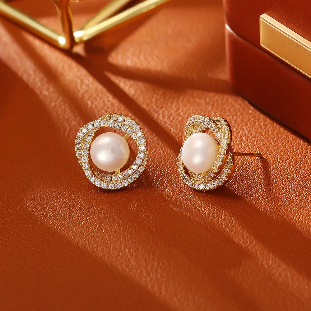 Glass pearl stud earrings with real gold plating on copper base, four colour options round geometric style