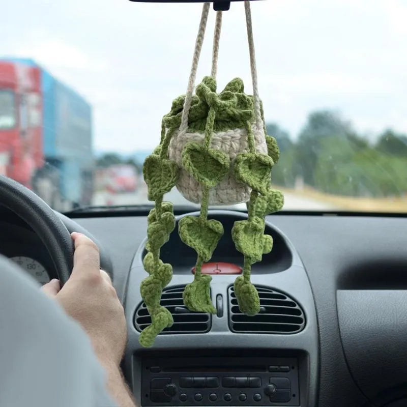 Green and white knitted wool car plant decoration with 8cm base and hanging rope.